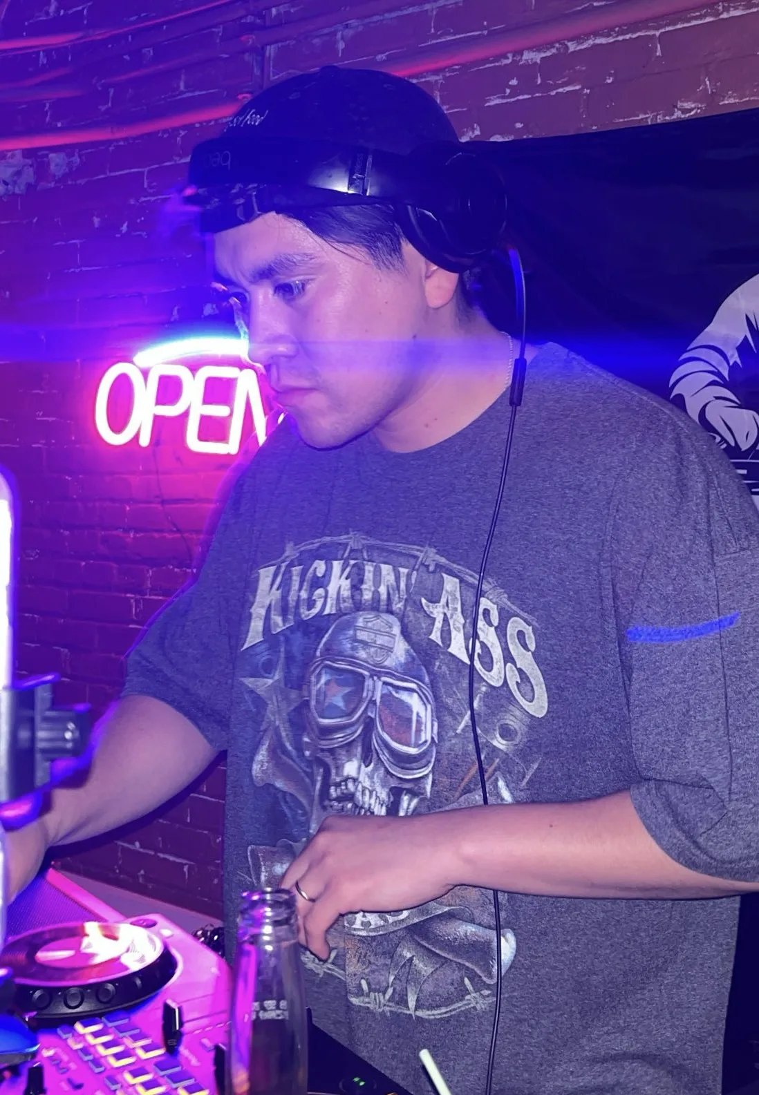 DJ Foca performing behind the DJ booth